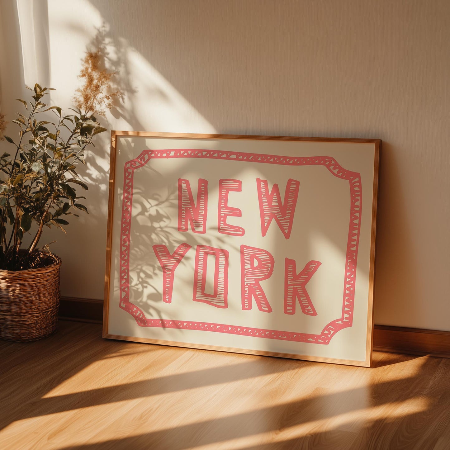 The words 'New York' in a funky, hand-drawn block font. Retro coral-pink printable wall art on a cream background with a sketchy border.