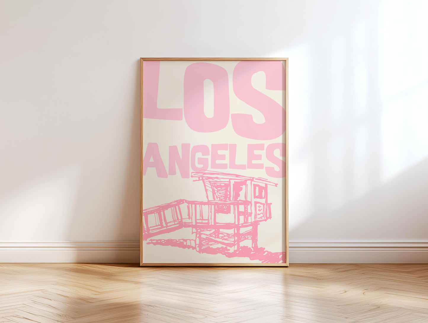Printable Los Angeles travel poster in pastel pink. The wall art features a sketchy illustration of a beach lifeguard tower and bold text.