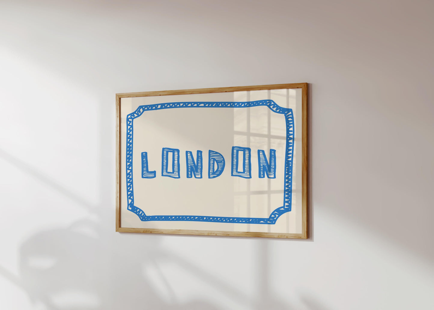 The word 'LONDON' in a funky, hand-drawn block font. Retro blue printable wall art on a cream background, framed by a sketchy border.