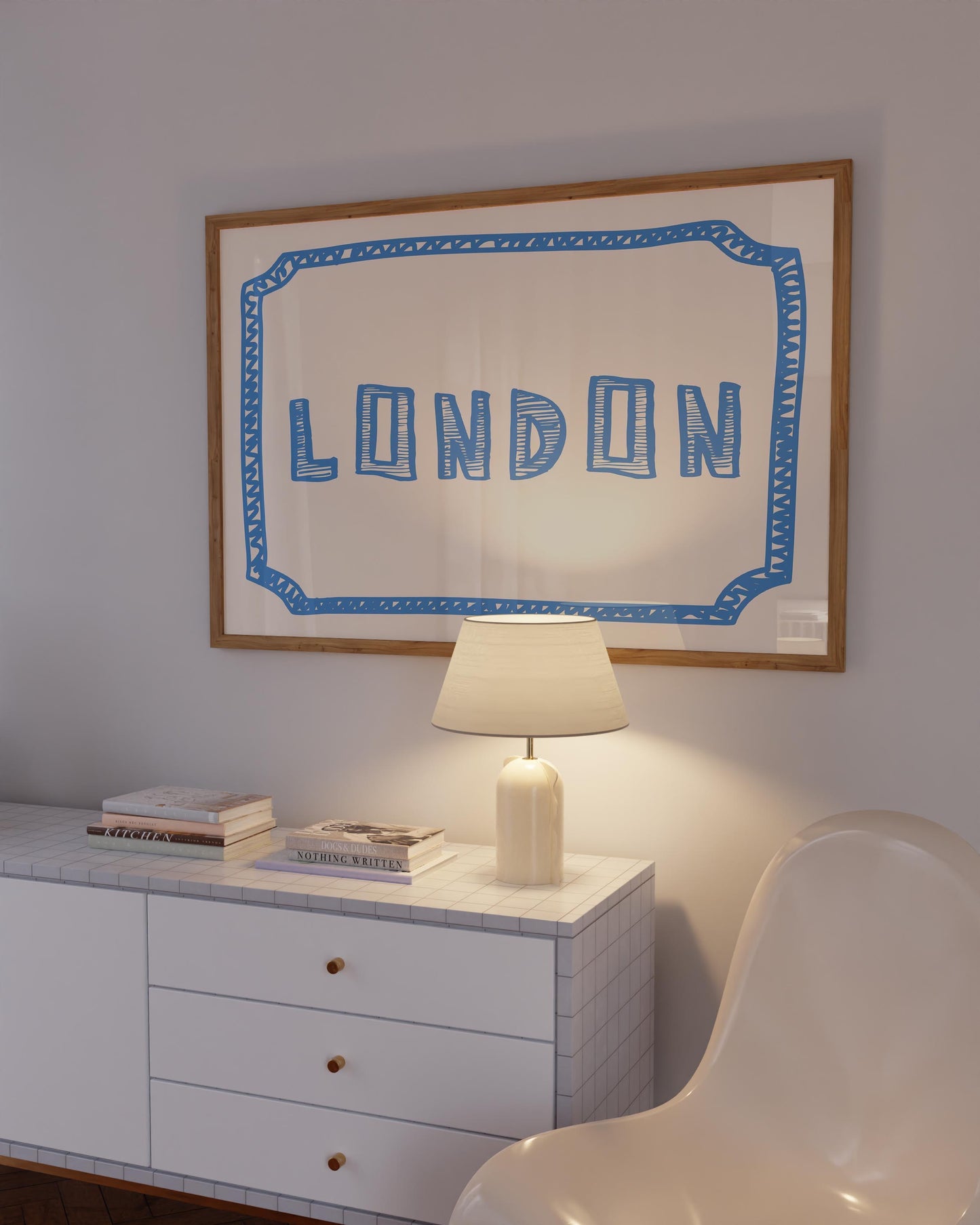 The word 'LONDON' in a funky, hand-drawn block font. Retro blue printable wall art on a cream background, framed by a sketchy border.
