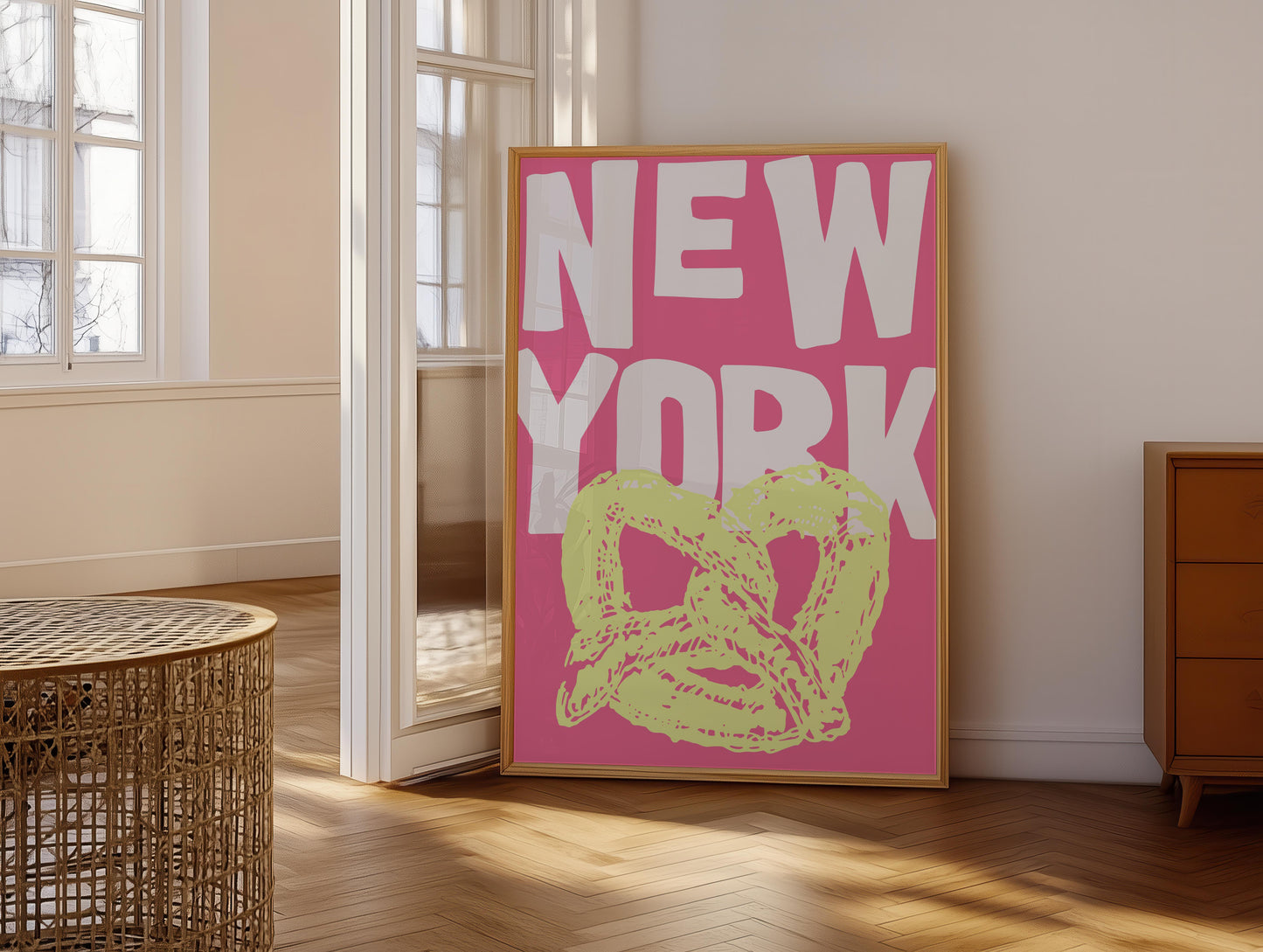 Funky pop art poster of a New York pretzel. The printable wall art has a yellow pretzel illustration against a bright pink background.