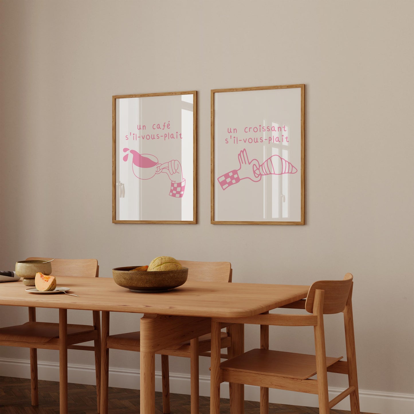 Set of two pink French cafe prints. One features a croissant, the other coffee, with French text. Quirky printable kitchen wall art.