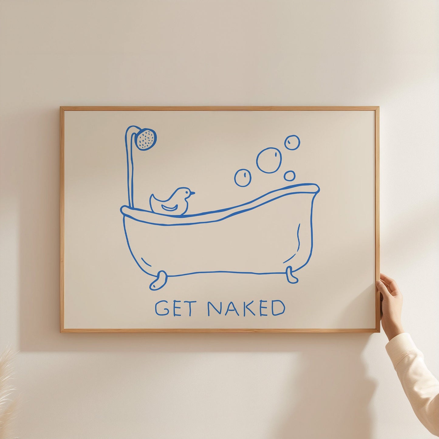 Hand-drawn blue line art of a bathtub with bubbles and a rubber duck, with text "GET NAKED" below.