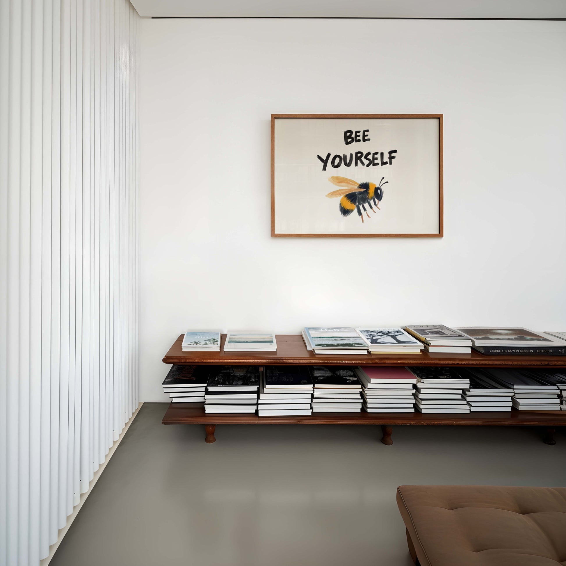 An inspirational bee print in a landscape frame, featuring a painterly bumblebee illustration under the quote 'Bee Yourself'.