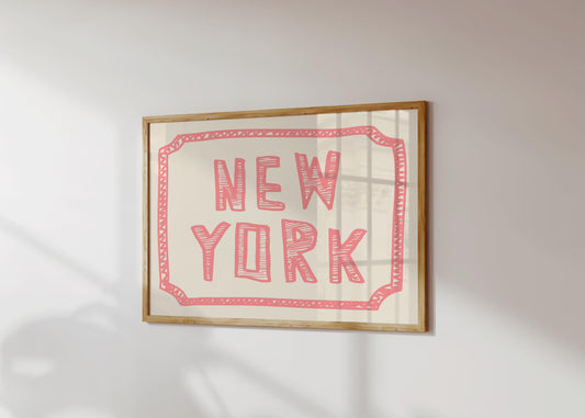 The words 'New York' in a funky, hand-drawn block font. Retro coral-pink printable wall art on a cream background with a sketchy border.