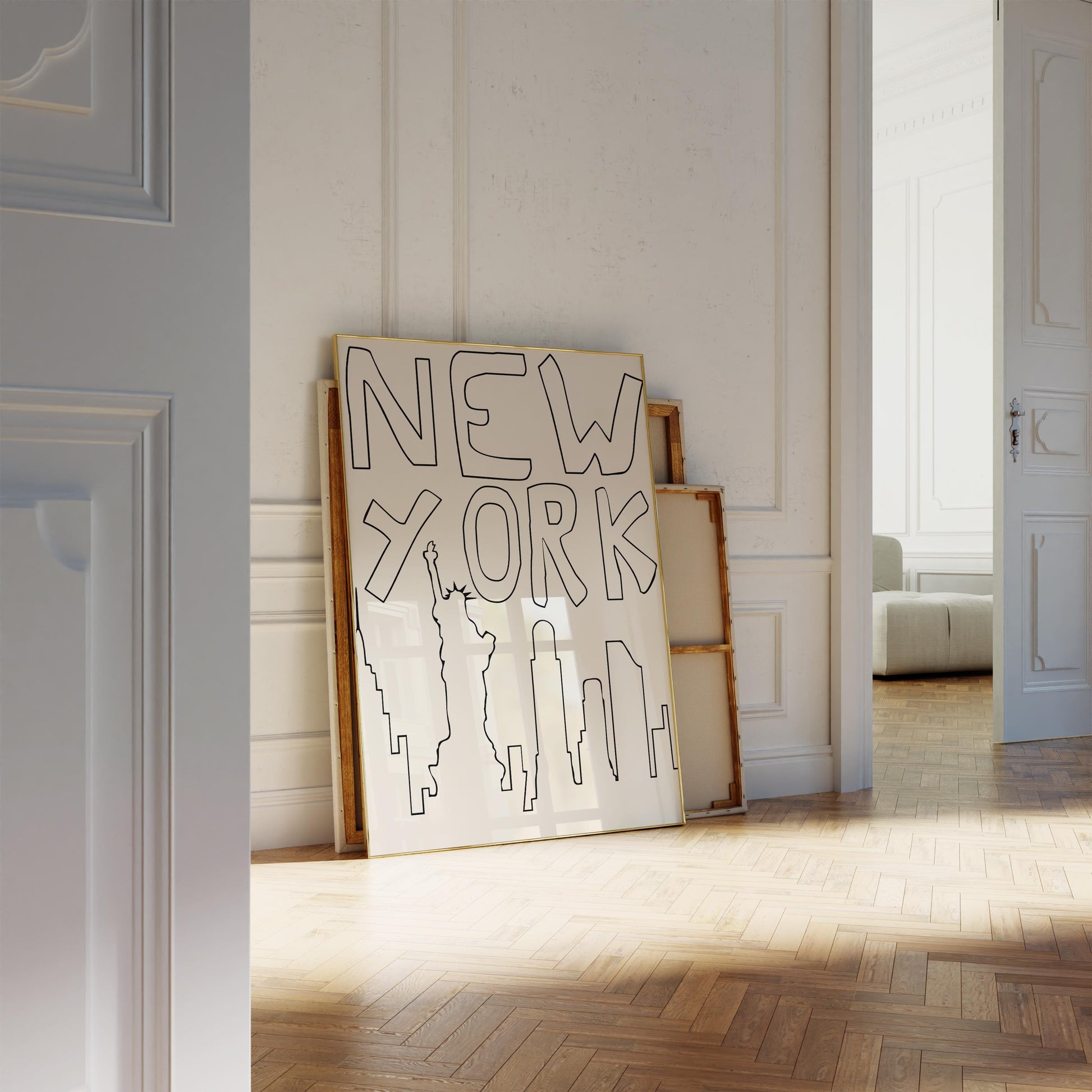 Minimalist NYC line art print leaning against a white wall. The black and beige printable poster features a quirky, hand-drawn skyline.