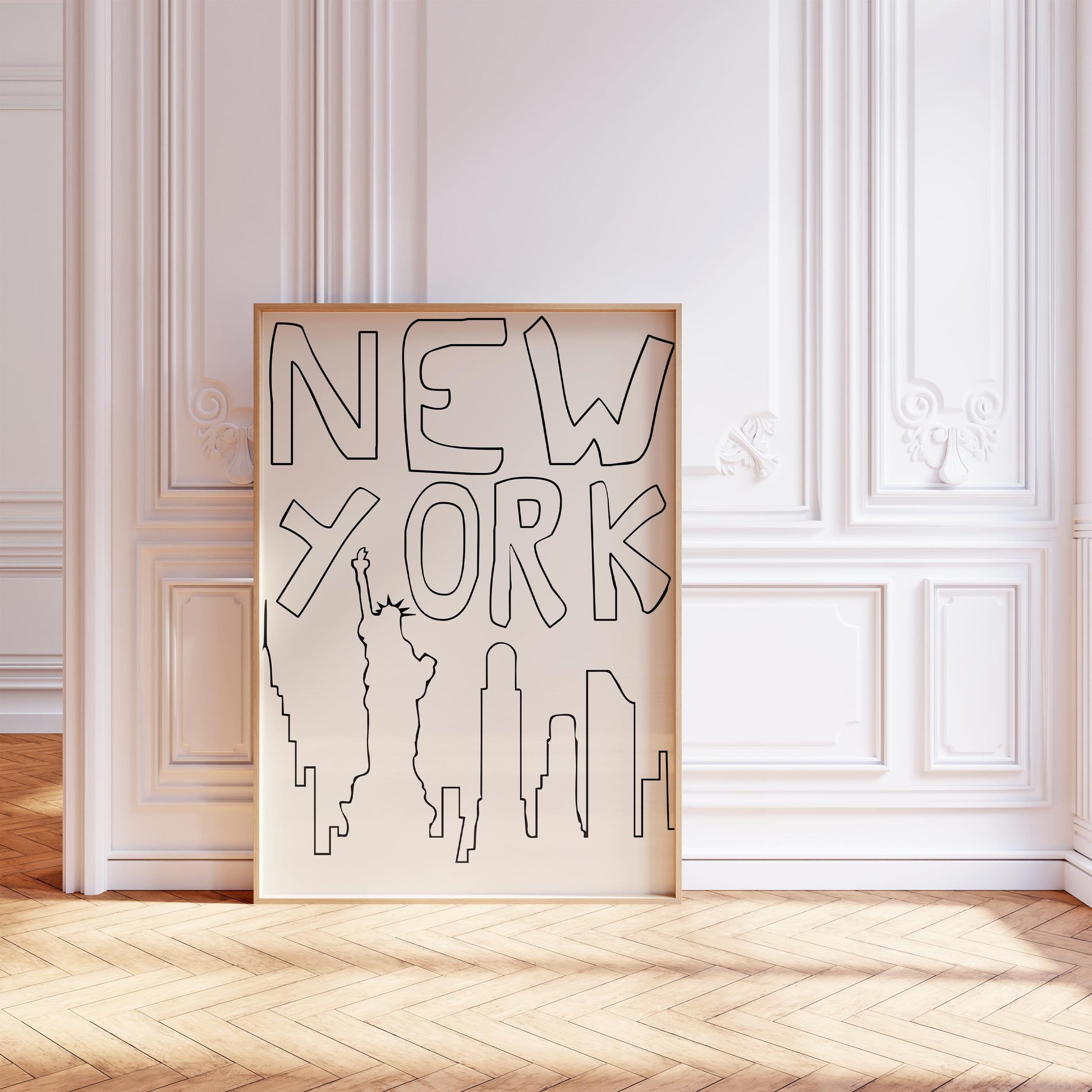 Minimalist NYC line art print leaning against a white wall. The black and beige printable poster features a quirky, hand-drawn skyline.