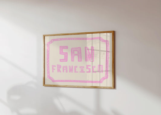 The words 'San Francisco' in a funky, hand-drawn block font. Retro pink printable wall art on a cream background with a doodle border.