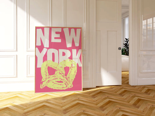 Funky pop art poster of a New York pretzel. The printable wall art has a yellow pretzel illustration against a bright pink background.