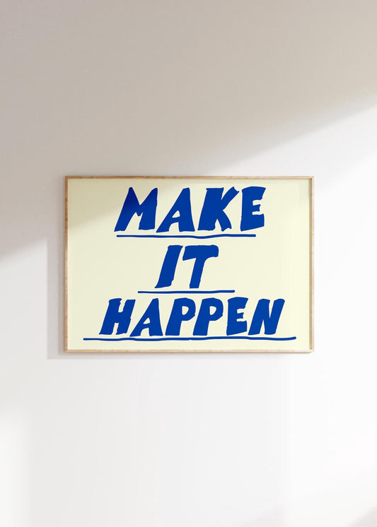 A framed motivational poster with the quote 'Make It Happen' in a bold, retro blue font on a cream background.