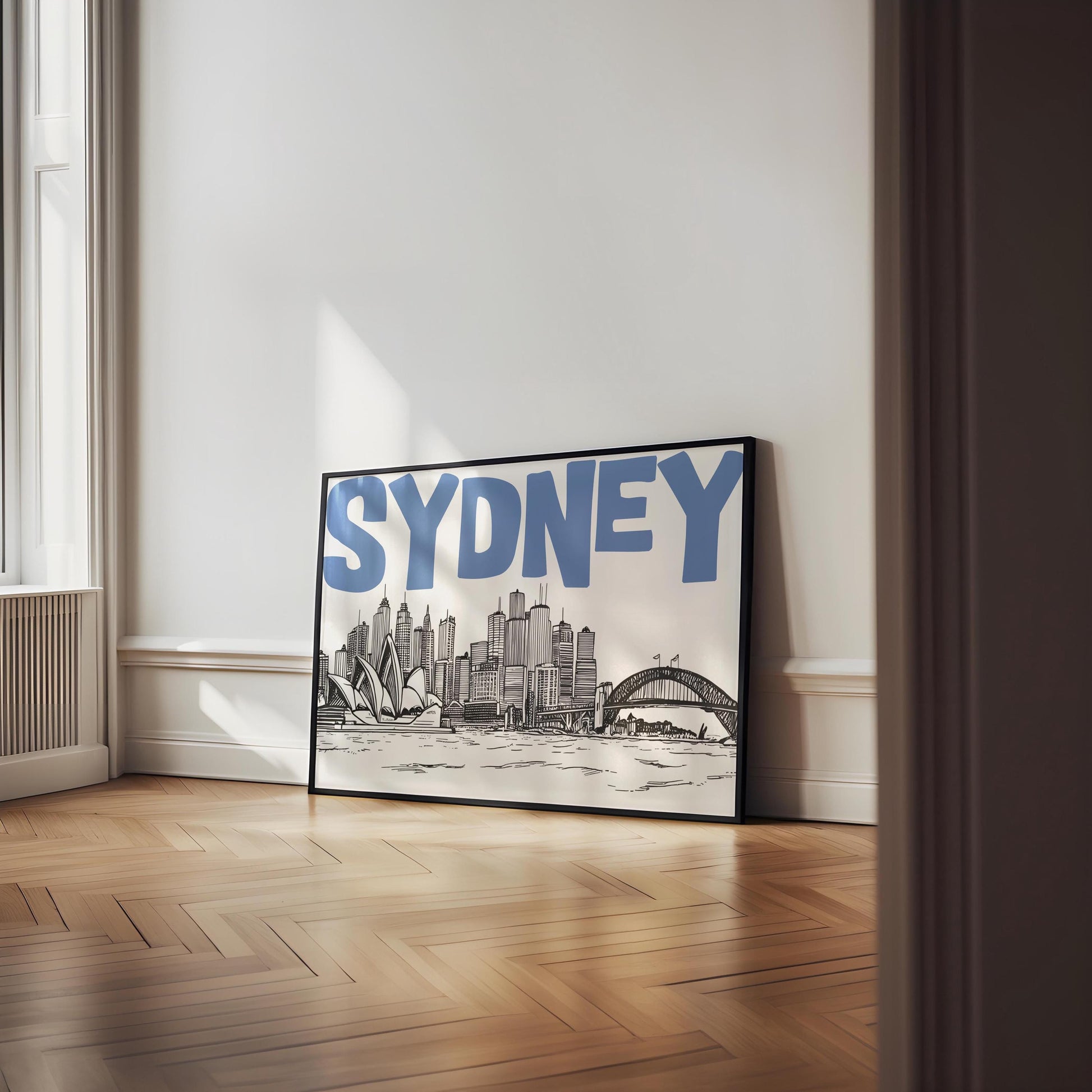 Modern Sydney wall art showing a sketch of the skyline and Opera House below the word 'SYDNEY' in bold blue font.