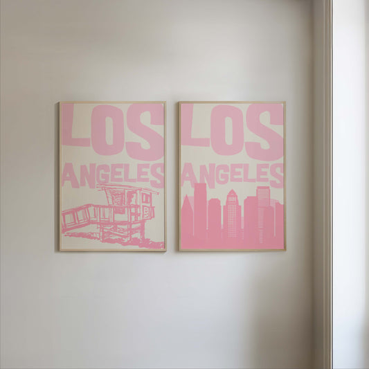 Set of two printable Los Angeles posters in pastel pink. Features the LA skyline and a lifeguard tower, perfect for a California gallery wall.