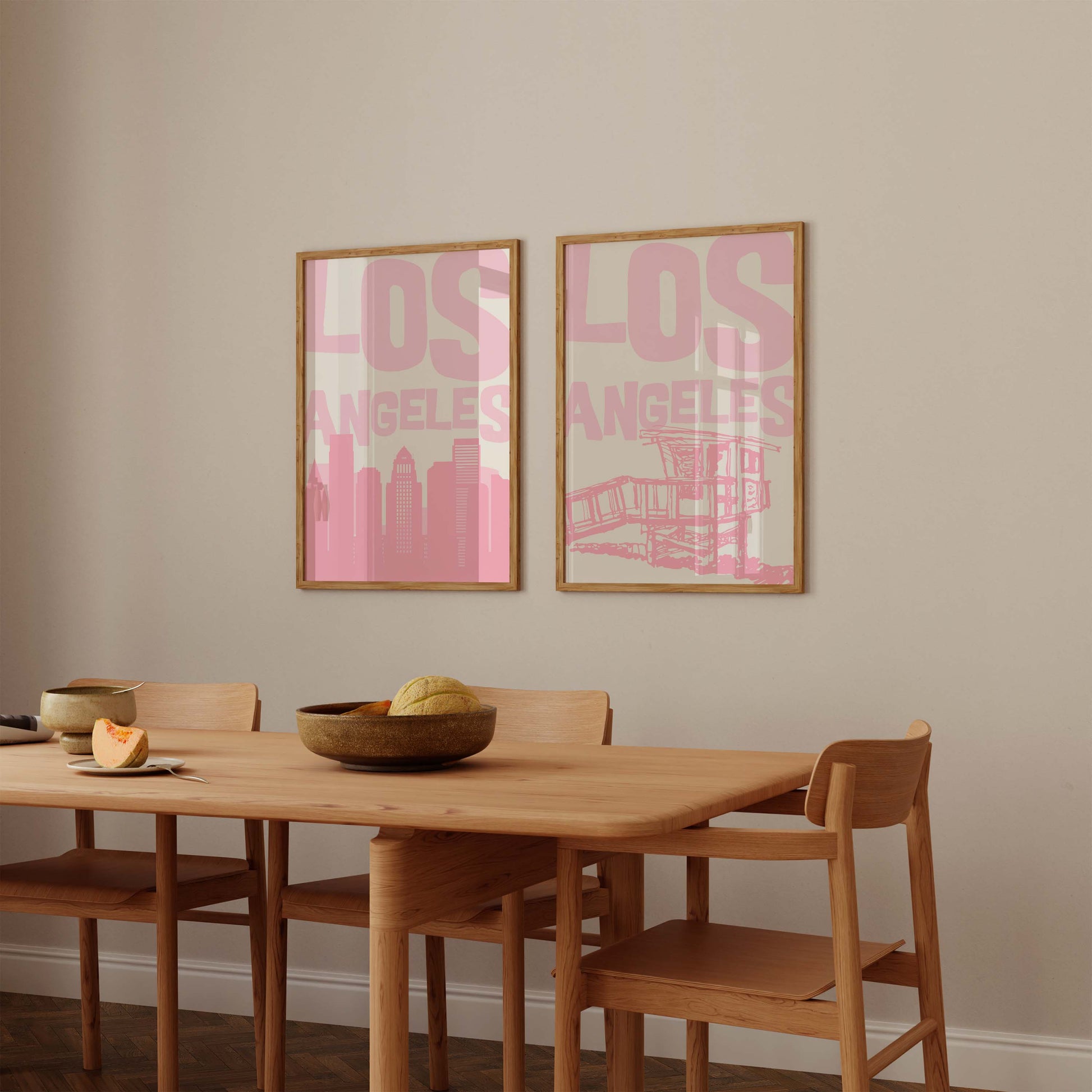 Set of two printable Los Angeles posters in pastel pink. Features the LA skyline and a lifeguard tower, perfect for a California gallery wall.