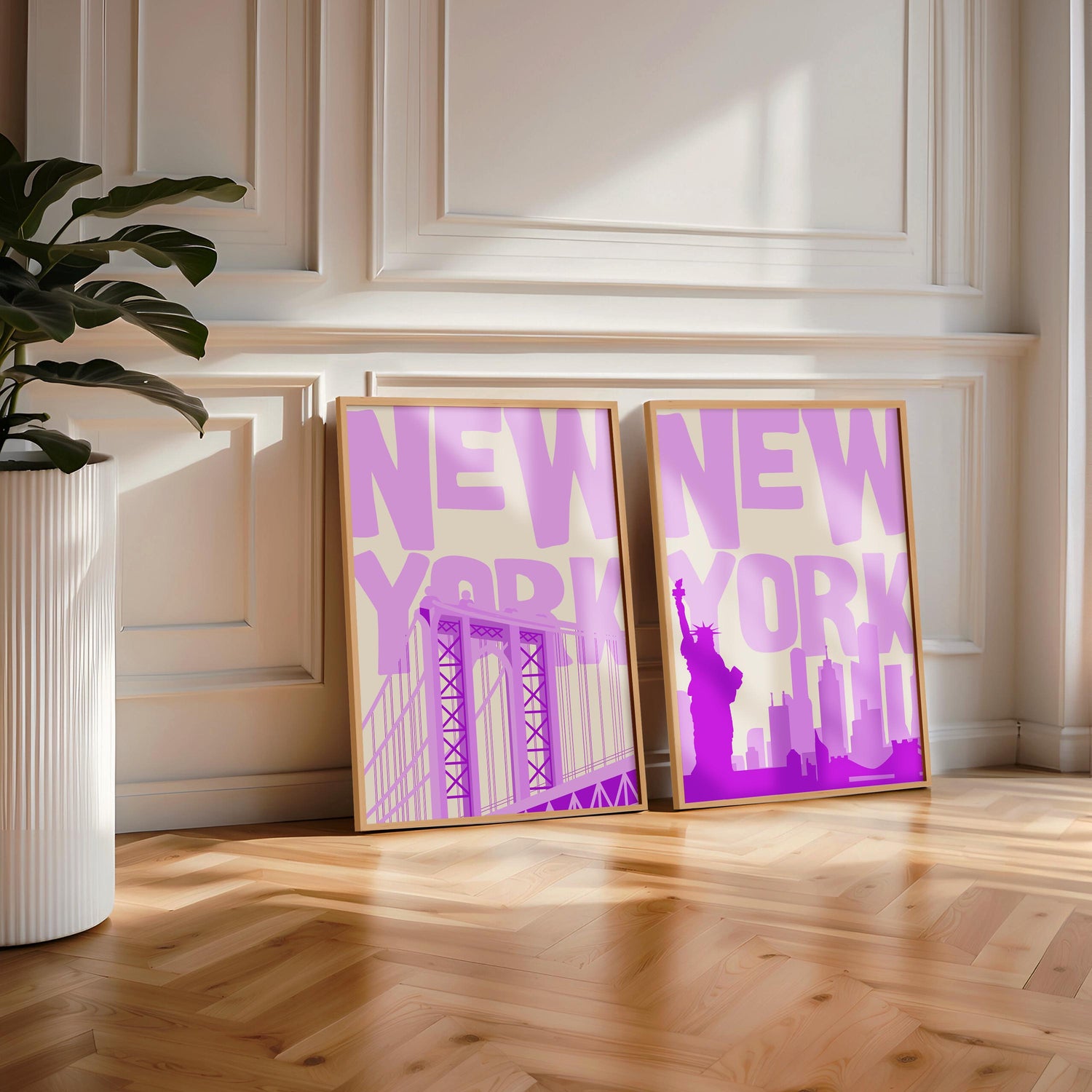Set of two printable wall art posters of New York City in a bold purple and beige color palette with modern typography.